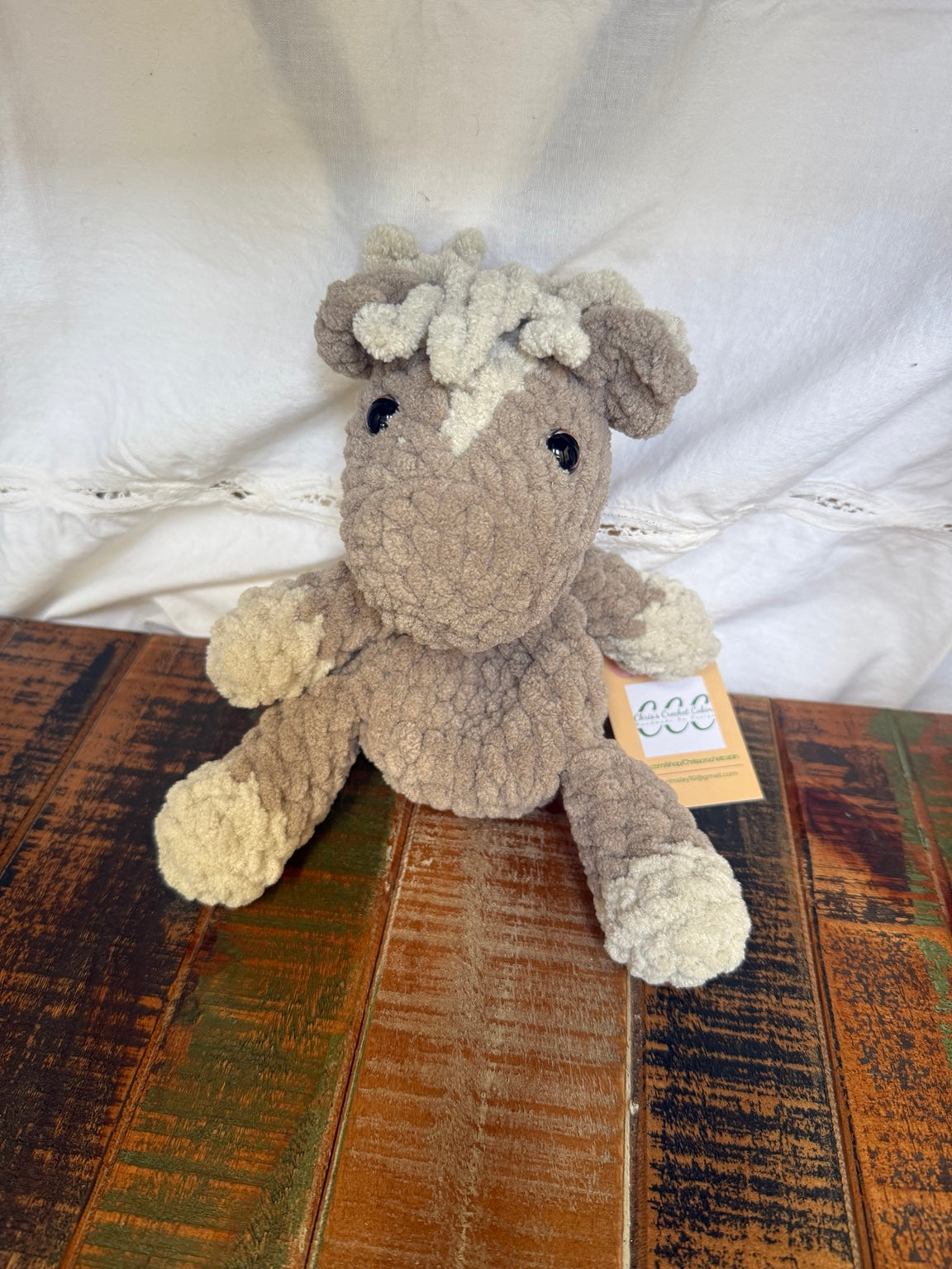 Bitty Pony Snuggler handmade crochet pony angled front view